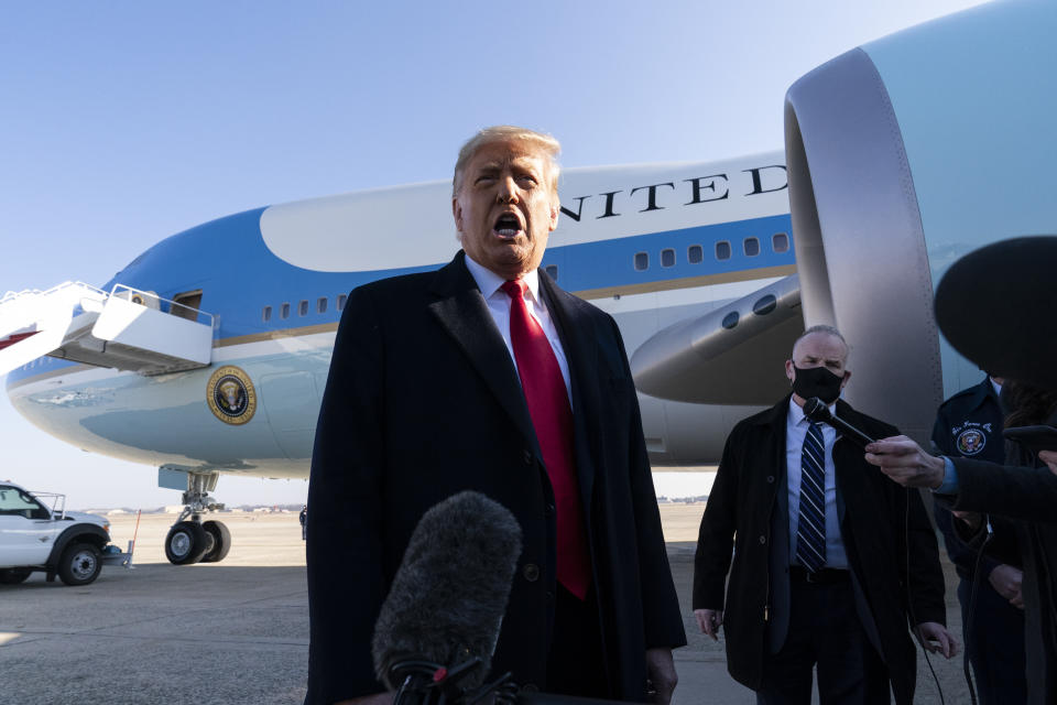 President Donald Trump speaks with reporters as he walks to Air Force One upon departure, Tuesday, Jan. 12, 2021, at Andrews Air Force Base, Md. (AP Photo/Alex Brandon)