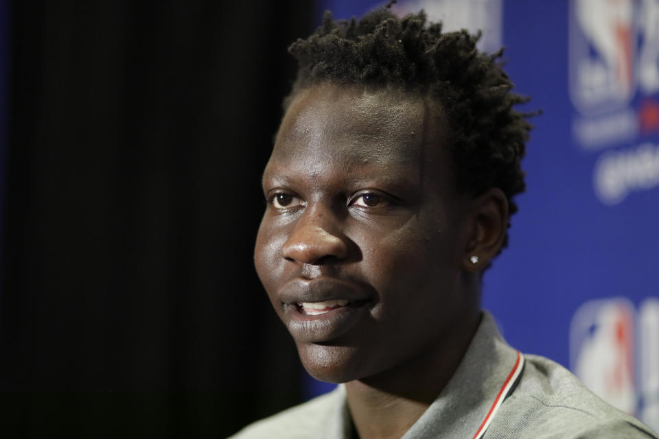 Bol Bol, a freshman basketball player from Oregon, attends the NBA Draft media availability, Wednesday, June 19, 2019, in New York. The draft will be held Thursday, June 20. (AP Photo/Mark Lennihan)