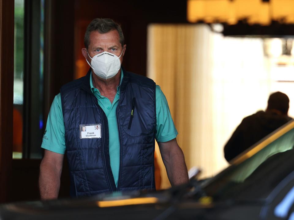 Frank Slootman wearing a mask while walking out of Sun Valley Lodge