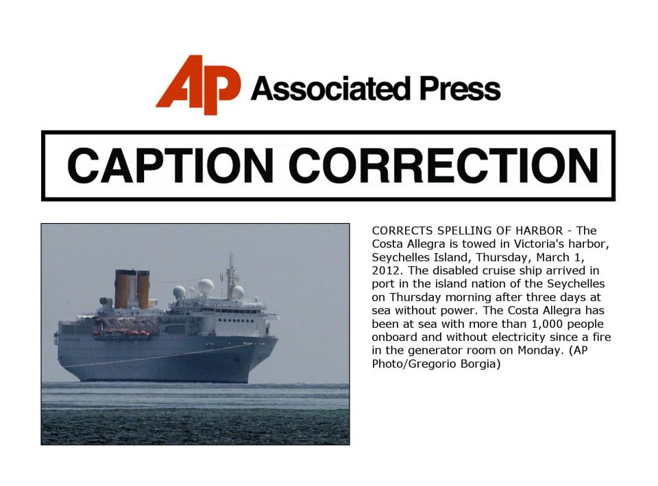 CORRECTS SPELLING OF HARBOR - The Costa Allegra is towed in Victoria's harbor, Seychelles Island, Thursday, March 1, 2012. The disabled cruise ship arrived in port in the island nation of the Seychelles on Thursday morning after three days at sea without power. The Costa Allegra has been at sea with more than 1,000 people onboard and without electricity since a fire in the generator room on Monday. (AP Photo/Gregorio Borgia)