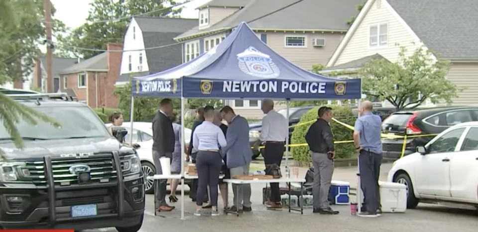 Police at the scene of a triple stabbing in Newton, Massachusetts, on Sunday (NBC Boston)
