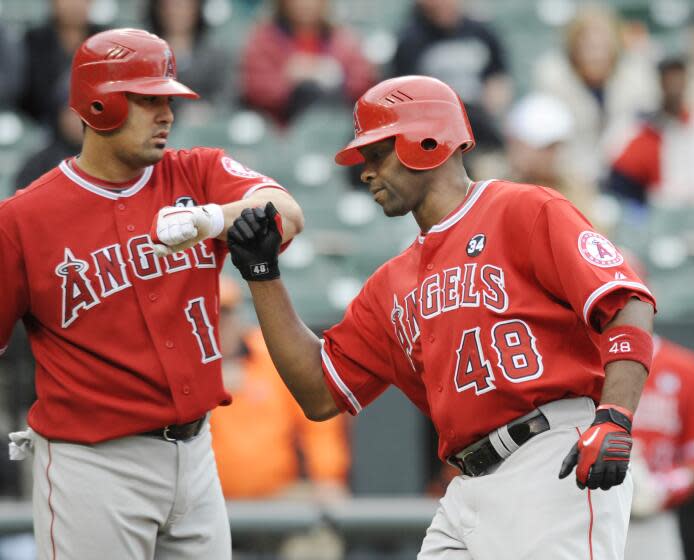 Angels' Torri Hunter is congratulated by Kendry Morales after hitting a home run against the Orioles on April 29, 2009.