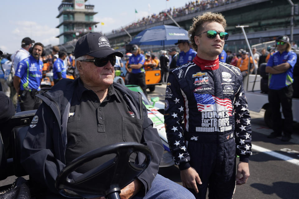 A.J. Foyt, left, talks with Santino Ferrucci during qualifications for the Indianapolis 500 auto race at Indianapolis Motor Speedway, Saturday, May 20, 2023, in Indianapolis. (AP Photo/Darron Cummings)