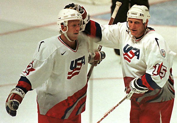 OTTAWA, CANADA: Brett Hull (r) of Team USA pats teammate Brian Leetch on the head after Hull scored the second goal in the first period against Team Russia in their third round playoff game at the World Cup of Hockey at the Corel Center in Ottawa 08 Sept. The winner will meet Team Canada in the final round. AFP PHOTO Carlo ALLEGRI/ca (Photo credit should read CARLO ALLEGRI/AFP/Getty Images)