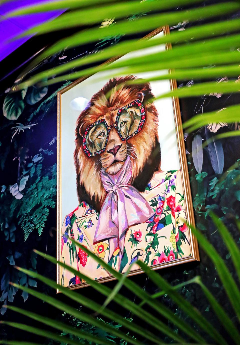 The new Square Scullery restaurant in North Hill has a unique atmosphere that the owner calls jungle disco with pictures of big cats and plants in every corner, Monday, Jan. 29, 2024, in Akron, Ohio.