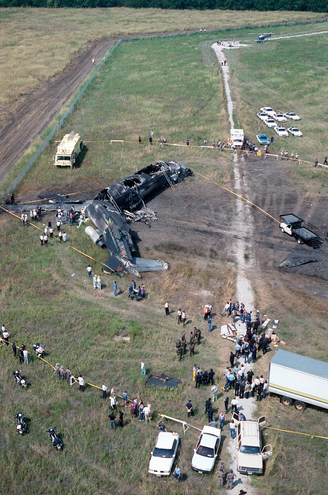 Aug. 31, 1988: Aerial view of the Delta Flight 1141 crash at Dallas-Fort Worth International Airport. The deceased were placed in a makeshift morgue transport truck, set up on site by the Tarrant County Medical Examiner’s Office. Twelve passengers and two crew members perished.