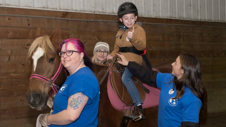 Cut to grant program worries group that gives kids with disabilities horseback lessons