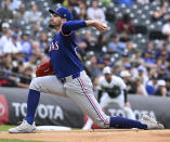 Texas Rangers starting pitcher Andrew Heaney throws in the first inning of a baseball game against the Colorado Rockies, Saturday, May 11, 2024, in Denver. (AP Photo/Jerilee Bennett)