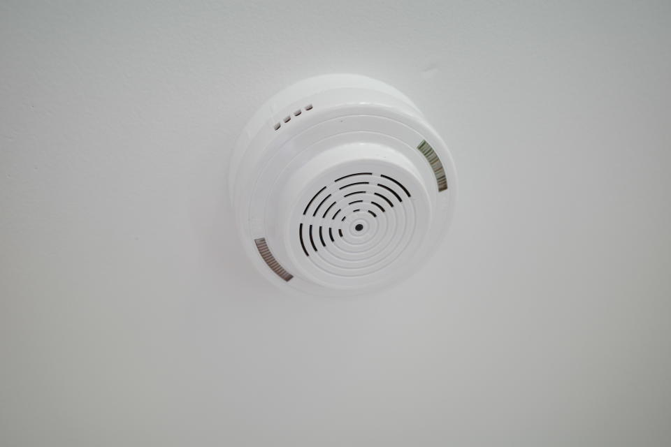 a smoke detector on the wall