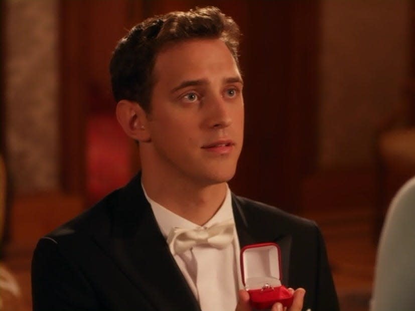 Stephen Hagan proposing in a black tux in "a royal chrismtas"