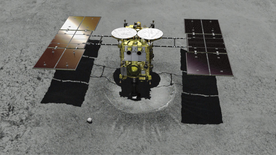 En esta imagen de archivo, creada con computadora y distribuida por la Agencia Japonesa de Exploración Aeroespacial (JAXA), se muestra la sonda espacial no tripulada Hayabusa2 acercándose al asteroide Ryugu. (JAXA vía AP, archivo)