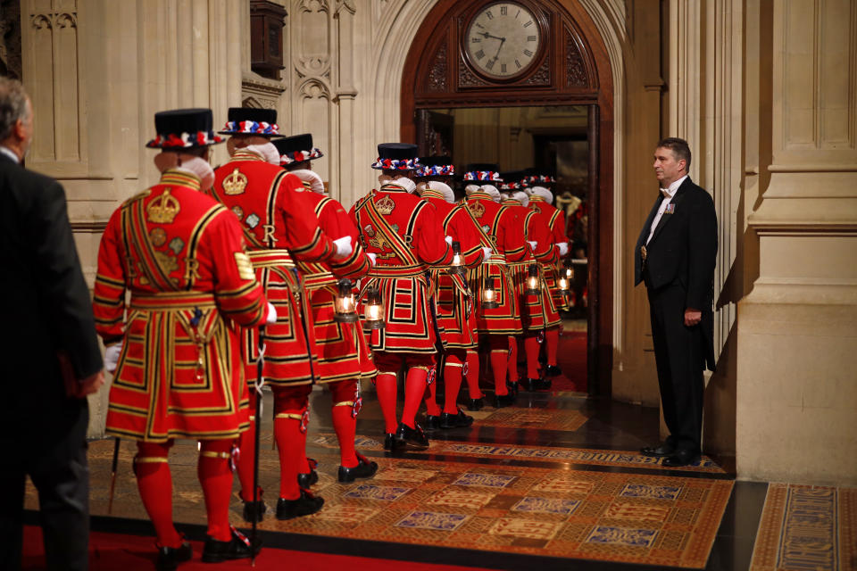 Yeomen of the Guard pass through the Peer's Lobby to attend the official State Opening of Parliament in London, Monday Oct. 14, 2019. (Tolga Akmen/Pool via AP)