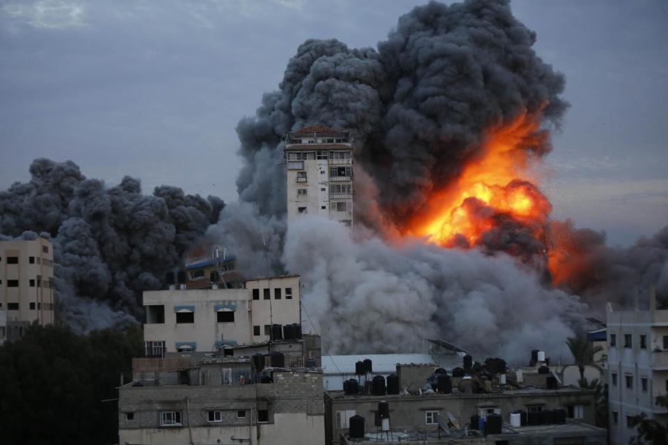 Smoke and flames rise from an Israeli airstrike on a shopping center
