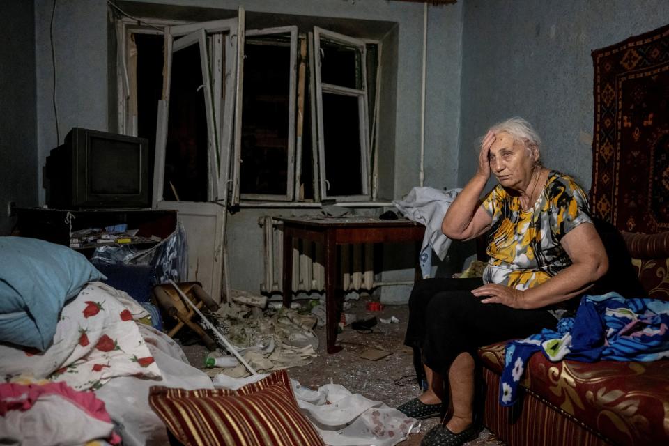 A wounded local resident is seen in her destroyed flat in an apartment building destroyed during a Russian missile strike (REUTERS)