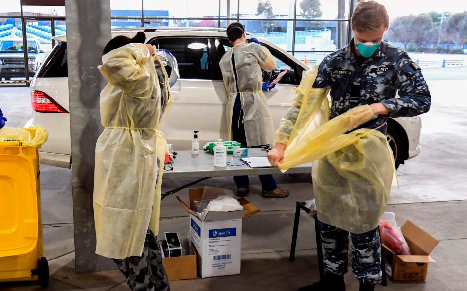 Australian military staff test people in Melbourne - GETTY IMAGES