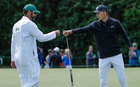 Jordan Spieth is congratulated by caddie Michael Greller - Credit: AP