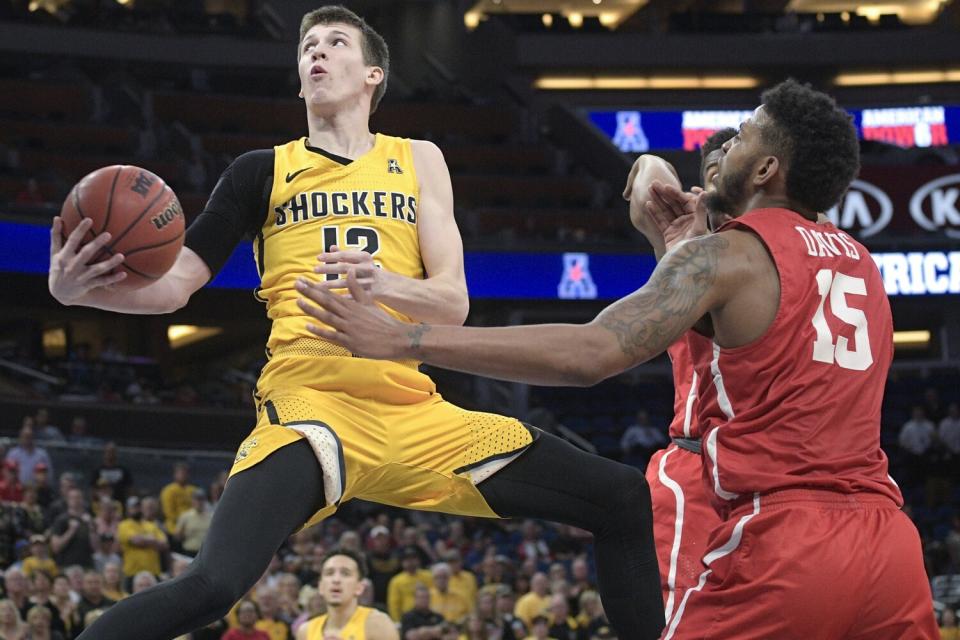 Austin Reaves elevates for a scoop shot while playing for Wichita State.