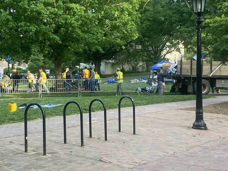 Police and crews cleaning up the encampment area Tuesday morning. (Joseph Holloway / CBS 17)
