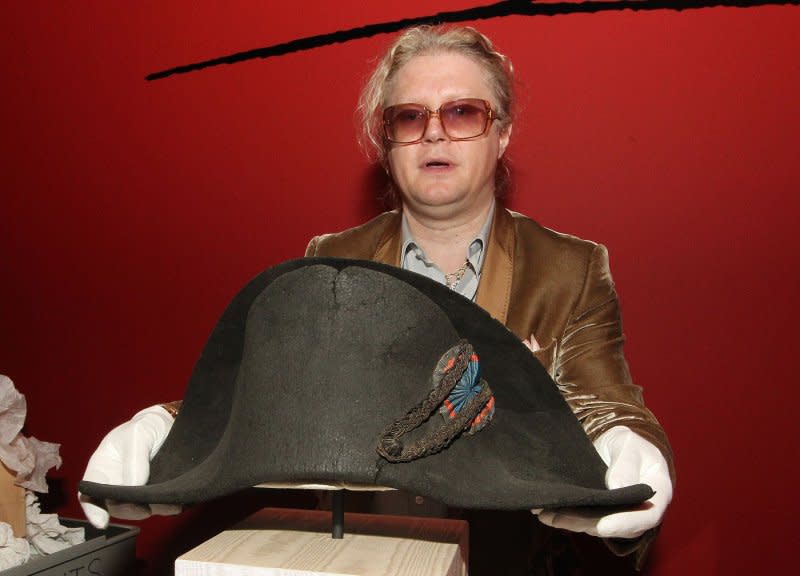 Pierre-Jean Chalencon places the famous hat worn by Napoleon Bonaparte onto a stand. On December 2, 1804, Napoleon crowned himself emperor of France. File Photo by Bill Greenblatt/UPI