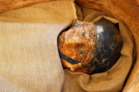 A mummy that was discovered near the King Amenemhat II pyramid is displayed during a presentation, south of Cairo