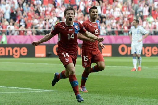 Czech midfielder Vaclav Pilar celebrates after scoring with Czech forward Milan Baros (R) during the Euro 2012 championships football match Greece vs Czech Republic at the Municipal Stadium in Wroclaw. Czech Republic were on course for a win which would keep alive their hopes of reaching the Euro 2012 quarter-finals as they led Greece 2-0 at half-time of their Group A clash here Tuesday