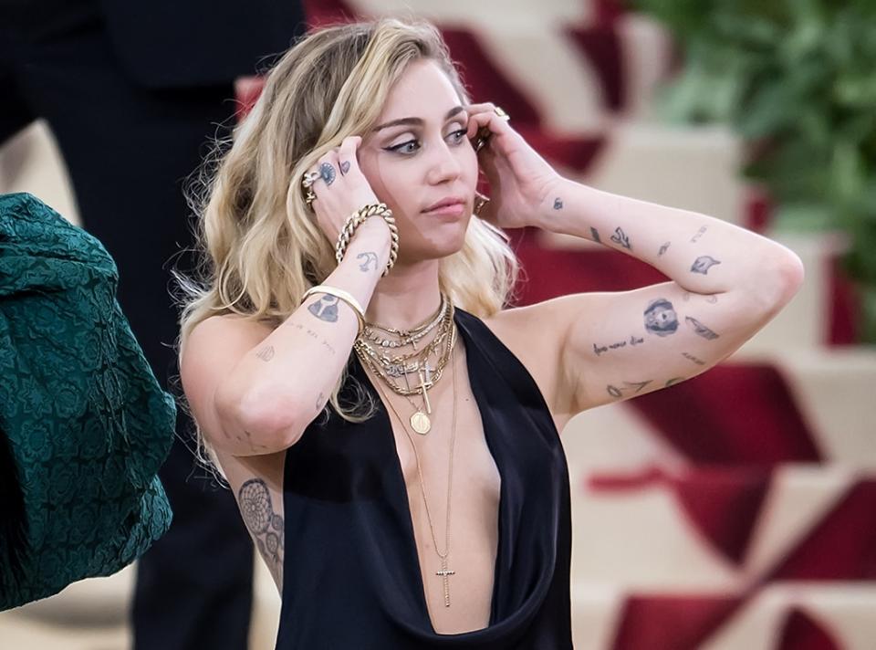 <p>25. In 2010, Miley's Disney darling image went up in smoke <a href="https://www.eonline.com/news/1218345/miley-cyrus-celebrates-infamous-bong-videos-10-year-anniversary-and-answers-a-burning-question" rel="nofollow noopener" target="_blank" data-ylk="slk:when a now-infamous video surfaced;elm:context_link;itc:0;sec:content-canvas" class="link ">when a now-infamous video surfaced</a> of the star taking a hit from a bong. A decade later, Miley hilariously celebrated the scandal's anniversary on Instagram.</p> <p>"Happy 10 year anniversary to the groundbreaking video of a teenager smoking a bong & saying dumb s--t to their friends," she wrote. "(Not sure the director of this fine film should be considered a 'friend' but...)" She also answered a burning question, writing, "#YesItWasReallySalvia #IfYouFindWeedThatDoesThisToYouSHARE."</p> <p>26. In a <a href="https://twitter.com/MileyCyrus/status/1164595246241603584?lang=en" rel="nofollow noopener" target="_blank" data-ylk="slk:2019 tweet;elm:context_link;itc:0;sec:content-canvas" class="link ">2019 tweet</a>, Miley alleged the bong incident cost her a huge endorsement contract, writing, "I lost a massive Walmart deal at 17 for ripping a bong."</p> <p>27. Miley has 74 tattoos and got her first body art when she was 17.</p>