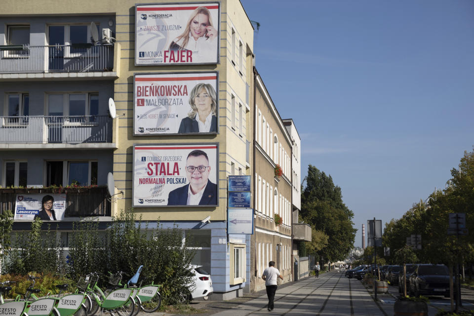 Political campaign posters hang on a building in Czestochowa, Poland, Tuesday, Oct. 3, 2023. As the ruling conservative Law and Justice party seeks to win an unprecedented third straight term in the Oct. 15 parliamentary election, it has sought to bolster its image as a defender of Christian values and traditional morality. Yet more and more Poles appear to be questioning their relationship with the Catholic church, and some cite its closeness to the government as a key reason. (AP Photo/Michal Dyjuk)