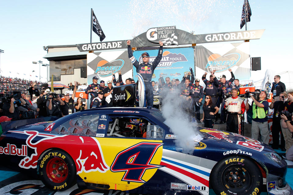 AVONDALE, AZ - NOVEMBER 13: Kasey Kahne, driver of the #4 Red Bull Toyota, celebrates in victory lane after winning the NASCAR Sprint Cup Series Kobalt Tools 500 at Phoenix International Raceway on November 13, 2011 in Avondale, Arizona. (Photo by Geoff Burke/Getty Images for NASCAR)