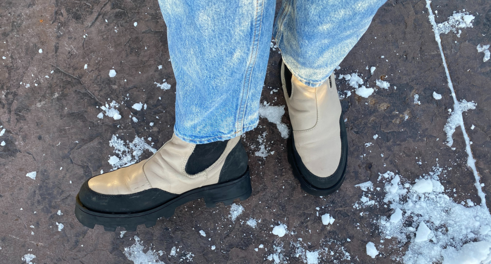 woman wearing blue jeans and black and beige cougar Shani Leather Waterproof winter Boots