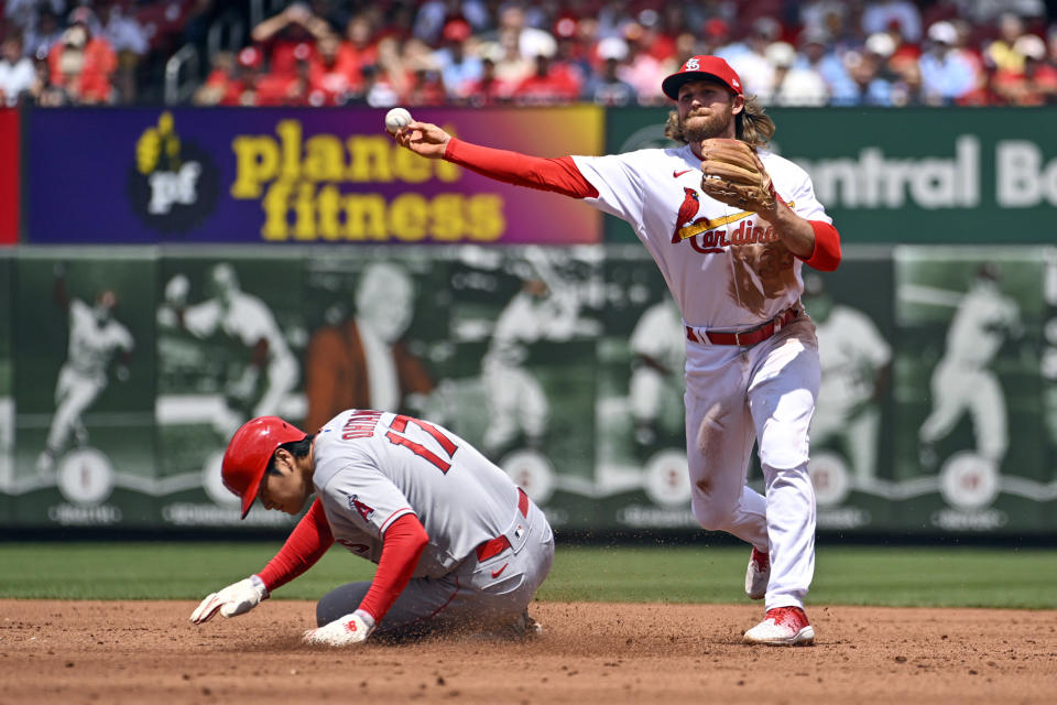 Los Angeles Angels' Shohei Ohtani (17) is forced out at second as St. Louis Cardinals second baseman Brendan Donovan, right, turns a double play in the third inning of a baseball game, Thursday May 4, 2023, in St. Louis. (AP Photo/Joe Puetz)