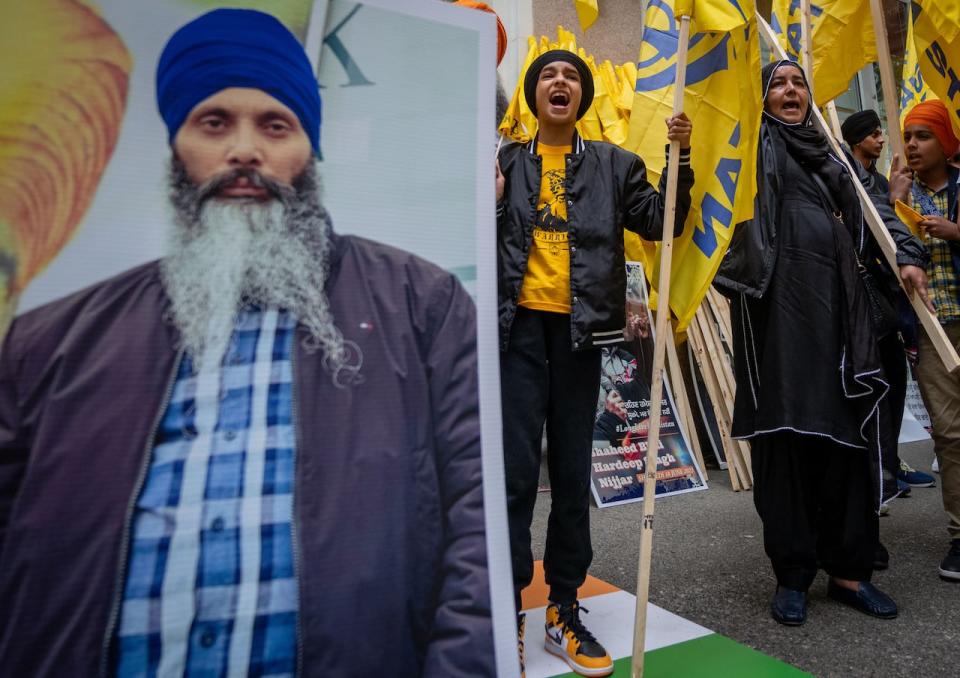 Protesters chant outside of the Consulate General of India office in response to the shooting death of Hardeep Singh Nijjar in Vancouver on Saturday, June 24, 2023. (Ethan Cairns/The Canadian Press - image credit)