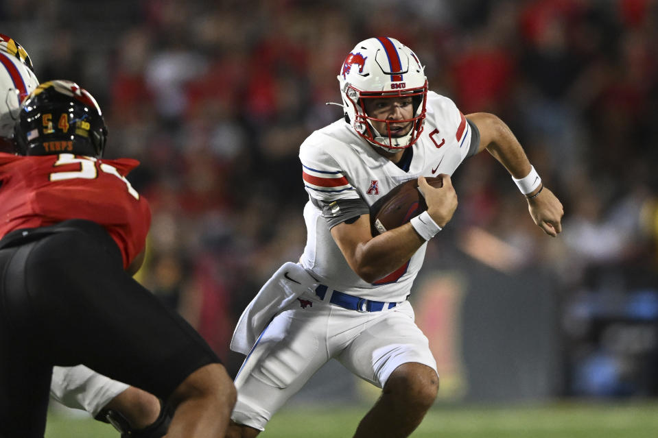 SMU quarterback Tanner Mordecal runs the ball against Maryland in the first half of an NCAA college football game, Saturday, Sept. 17, 2022, in College Park, Md. (AP Photo/Gail Burton)