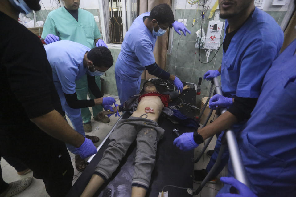 A Palestinian boy wounded in the Israeli bombing of the Gaza Strip is treated in Rafah, Thursday, Dec. 28, 2023. (AP Photo/Hatem Ali)