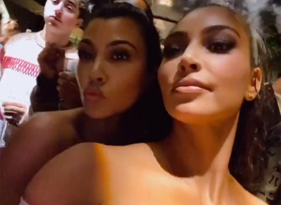 Kim posed for a selfie with her sister, Kourtney, who hosted the massive event. 