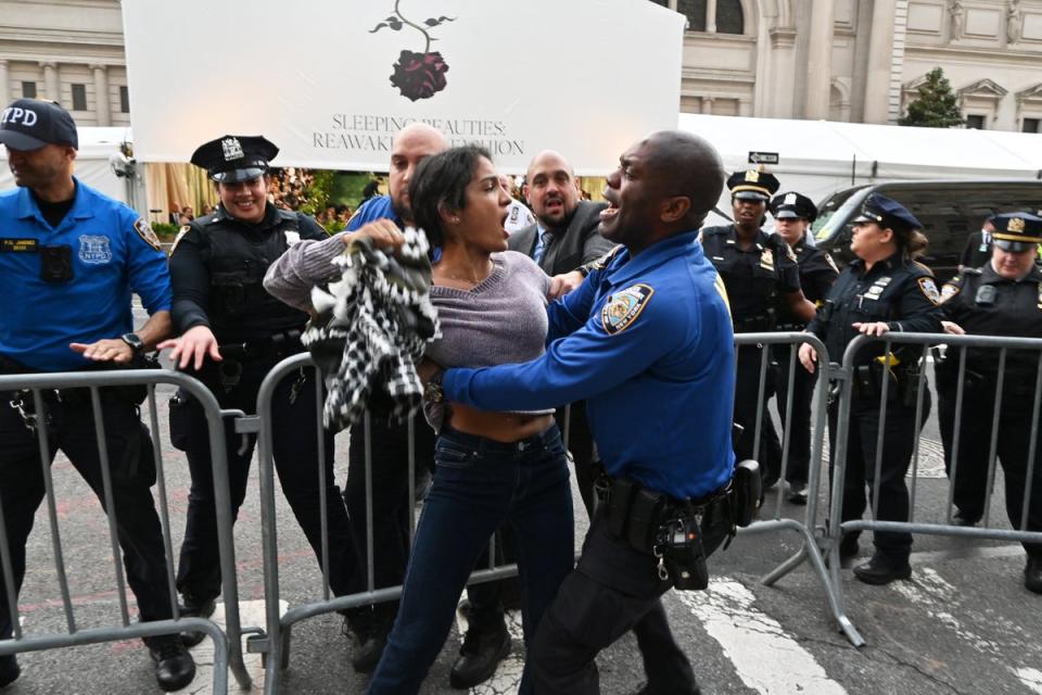 Police tackle pro-Palestinian protesters disrupting the arrivals for the 2024 Met Gala (AFP via Getty Images)