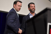 Donald John Trump Jr., right, shakes hands with Georgia state Sen. Burt Jones who is running for Lt. Governor, Wednesday, Sept. 22, 2021, in Marietta, Ga. The rewards of an early Donald Trump endorsement will be on display Saturday in Georgia. A three-man ticket of candidates he’s backing in 2022 Republican primaries for statewide office will take the stage with him. Completing the trio is Jones, an early Trump supporter who pushed measures to overturn President Joe Biden’s Georgia win. (AP Photo/Mike Stewart)