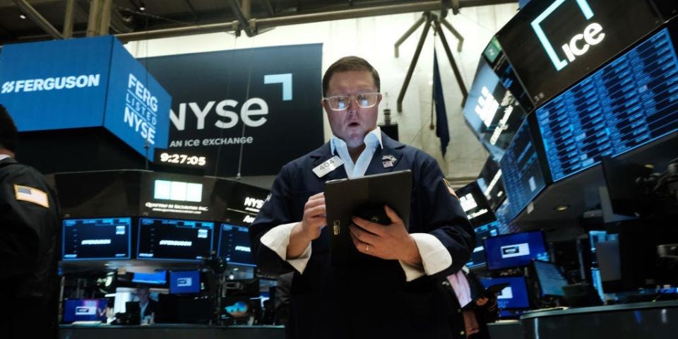 Traders work on the floor of the New York Stock Exchange (NYSE)