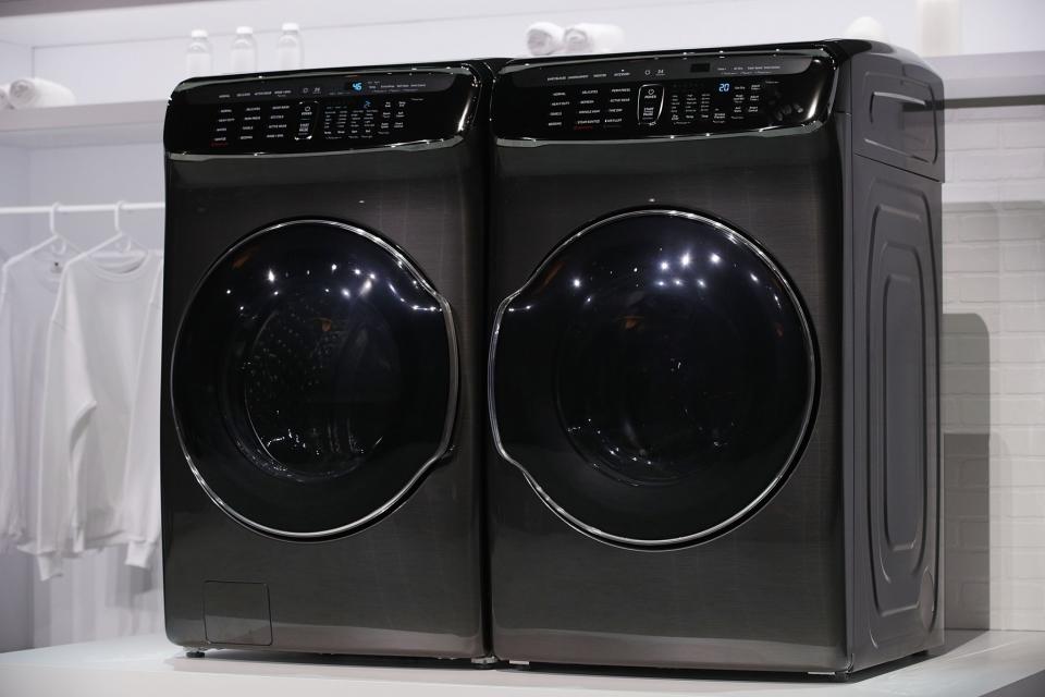 <p>The new Samsung FlexWash and FlexDry washer and dryer are on display during a press event for CES 2017 at the Mandalay Bay Convention Center on January 4, 2017 in Las Vegas, Nevada. The washer can take two loads at once (one 5 cubic foot load in the main drum, another in the 1 cubic foot space on top), and the dryer can dry both those loads separately, too. (Getty) </p>