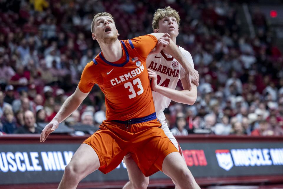 Clemson forward Bas Leyte (33) and Alabama forward Sam Walters battle under the basket during the first half of an NCAA college basketball game, Tuesday, Nov. 28, 2023, in Tuscaloosa, Ala. (AP Photo/Vasha Hunt)