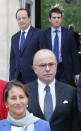 French President Francois Hollande, left behind, followed by new French Prime Minister Manuel Valls, arrive for the family picture while Environment and Energy minister Segolene Royal, left, Interior Minister Bernard Cazeneuve wait after the first weekly cabinet meeting after municipal elections, at the Elysee Palace in Paris, Friday, April 4, 2014. President Francois Hollande shook up the government this week after his Socialist Party suffered an electoral defeat in nationwide municipal elections. Among two new faces in the Cabinet is Segolene Royal, a longtime politician and mother of Hollande's children, as environment and energy minister. (AP Photo/Jacques Brinon)