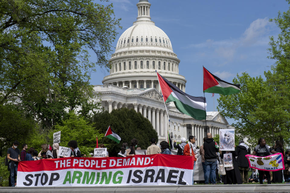 Pro-Palestinian activists demonstrate outside the Capitol in Washington, Saturday, April 20, 2024, as the House prepares to vote on approval of $95 billion in foreign aid for Ukraine, Israel and other U.S. allies. (AP Photo/J. Scott Applewhite)