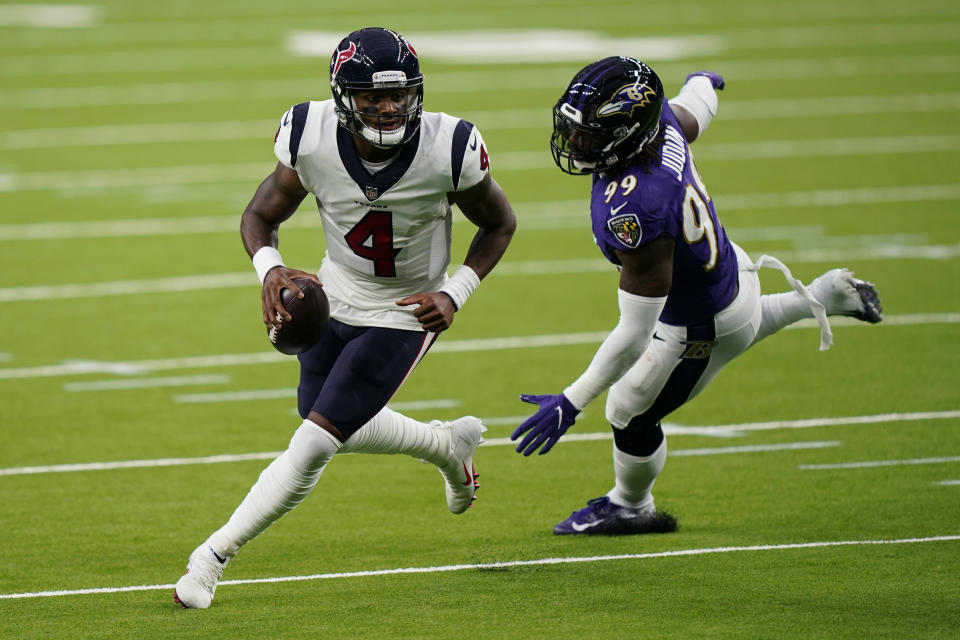 Houston Texans quarterback Deshaun Watson (4) scrambles a Baltimore Ravens outside linebacker Matt Judon (99) pressures him during the first half of an NFL football game Sunday, Sept.20, 2020, in Houston. (AP Photo/David J. Phillip)