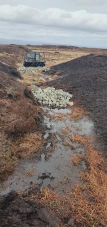 A stone dam at West Arkengarthdale Moor put in to help restore the peat (West Arkengarthdale Moor/PA)