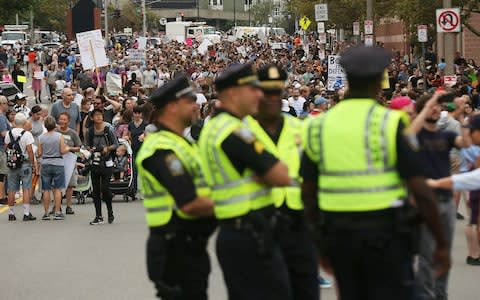 Police stand by as thousands of protesters prepare to march in Boston - Credit: Spencer Platt/Getty Images