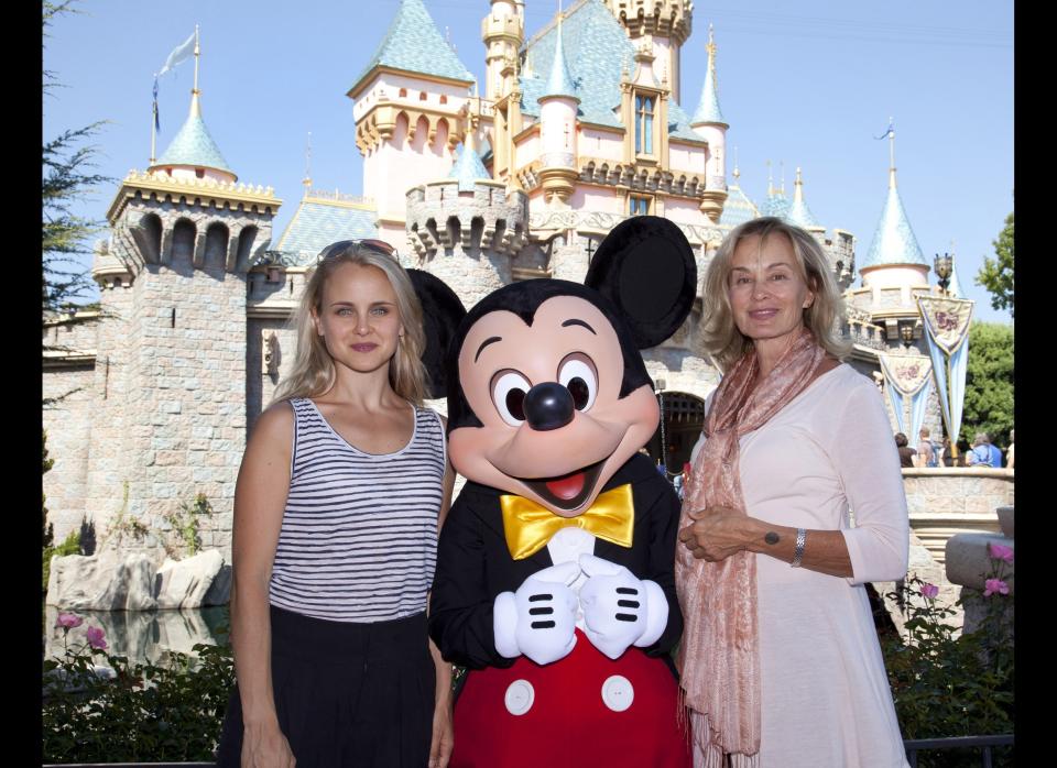 Jessica Lange (R) and daughter Shura pose with Mickey Mouse outside Sleeping Beauty Castle at Disneyland On September 2, 2011 in Anaheim, California.    (Photo by Paul Hiffmeyer/Disney Parks via Getty Images)