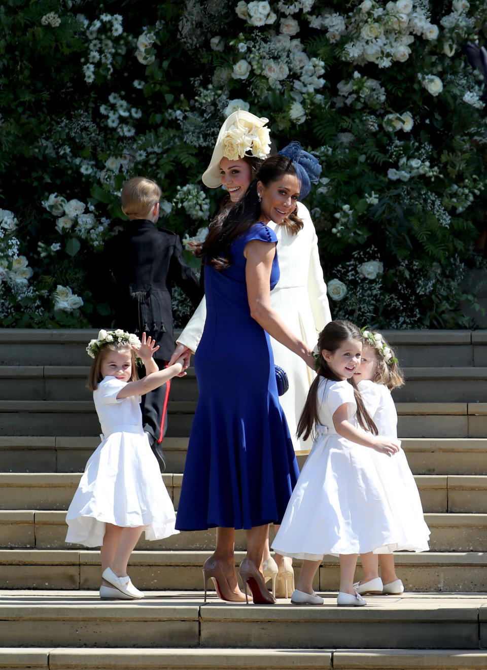  Princess Charlotte of Cambridge, Prince George of Cambridge, Catherine, Duchess of Cambridge, Jessica Mulroney, Ivy Mulroney and Florence van Cutsem after the wedding of Prince Harry and Ms. Meghan Markle at St George's Chapel at Windsor Castle on May 19, 2018 in Windsor, England.