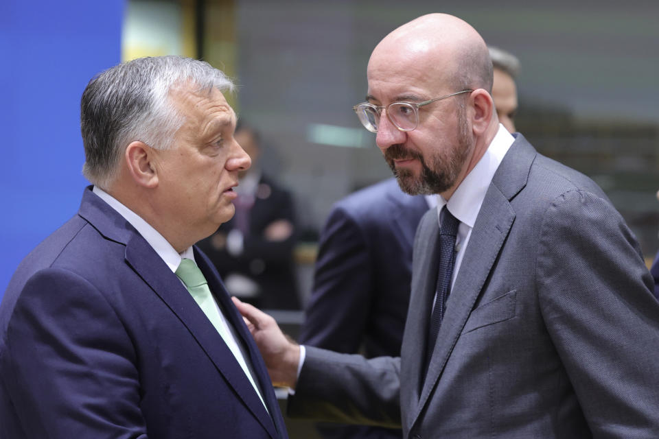 Hungary's Prime Minister Viktor Orban, left, speaks with European Council President Charles Michel during a round table meeting at an EU summit in Brussels, Thursday, March 23, 2023. European Union leaders meet Thursday for a two-day summit to discuss the latest developments in Ukraine, the economy, energy and other topics including migration. (AP Photo/Olivier Matthys)