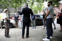 District attorney Larry Krasner, center, talks to volunteers before they canvas around the Fairmount neighborhood in Philadelphia, on Sunday, May 16, 2021. Voters will cast ballots Tuesday, May 18 in the Democratic Primary for Philadelphia District Attorney that pits reform-minded incumbent Krasner against veteran homicide prosecutor Carlos Vega, likely deciding the future of the office in the overwhelmingly Democratic city. (David Maialetti/The Philadelphia Inquirer via AP)