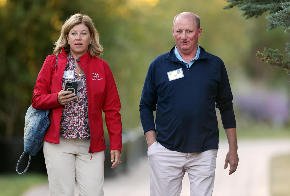 SUN VALLEY, IDAHO - JULY 14: Greg Abel, CEO of Berkshire Hathaway Energy, and Andrea Abel walk to a morning session at the Allen & Company Sun Valley Conference on July 14, 2023 in Sun Valley, Idaho. Every July, some of the world's most wealthy and powerful figures from the media, finance, technology and political spheres converge at the Sun Valley Resort for the exclusive weeklong conference. (Photo by Kevin Dietsch/Getty Images)