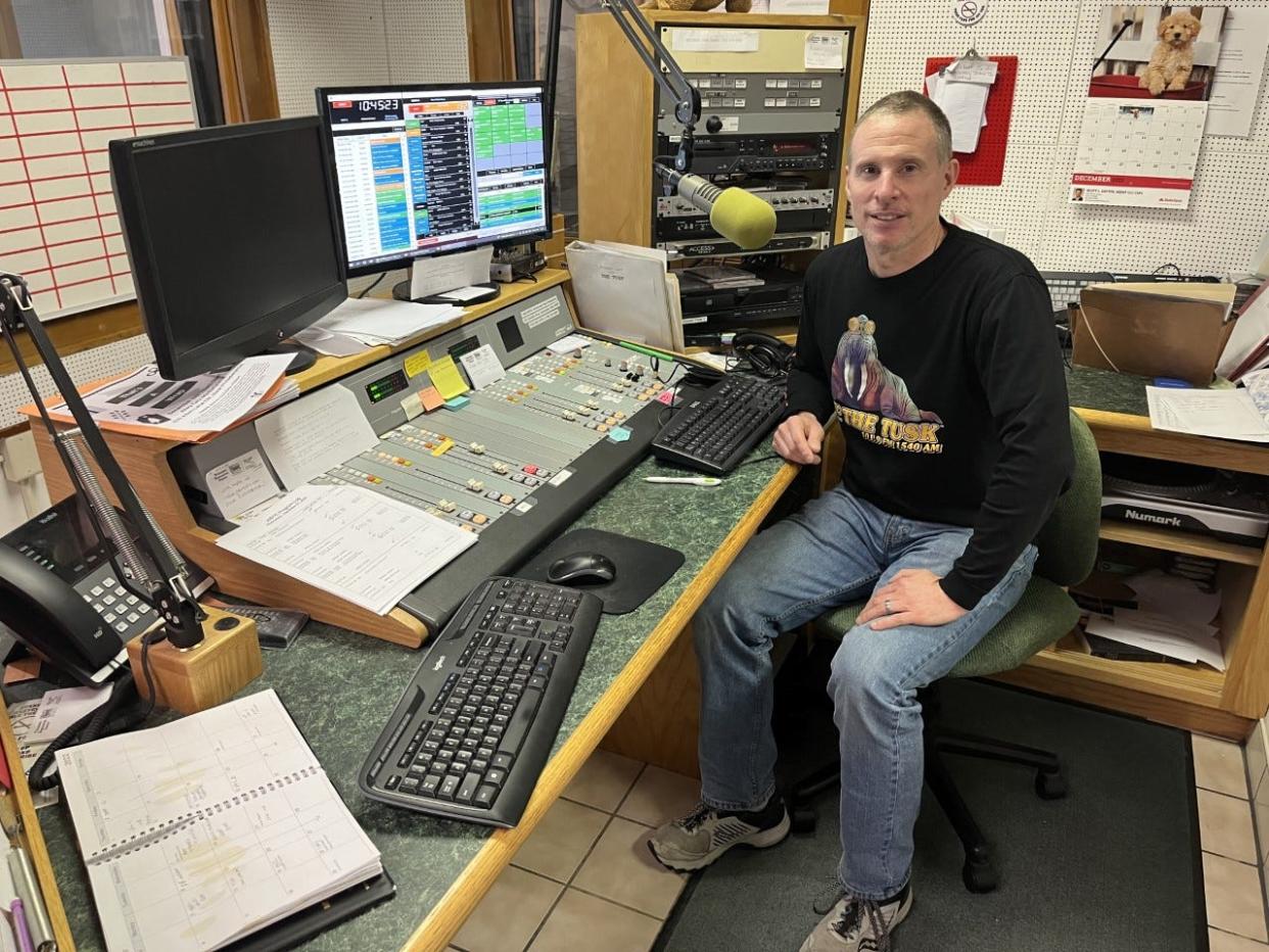 Brian Walker, one of the owners of WBTC-FM in Uhrichsville, poses in the station's studio.